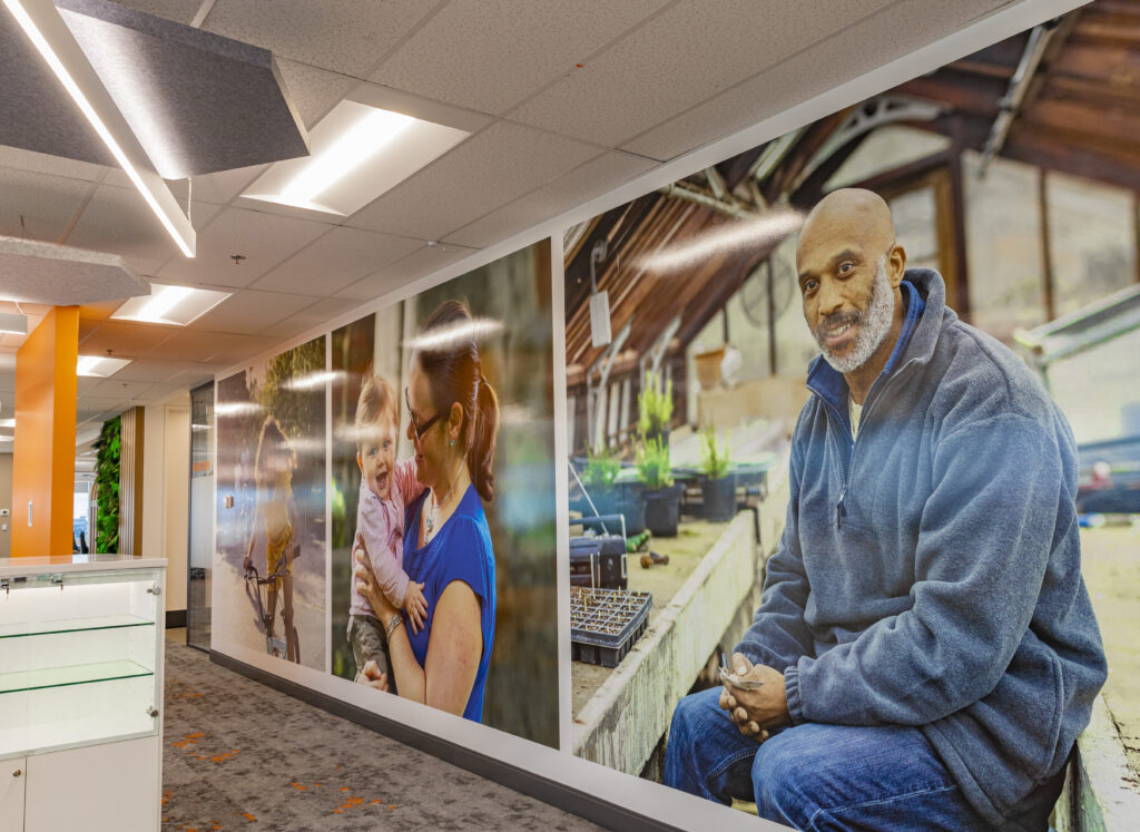large photographs of people on walls in an office