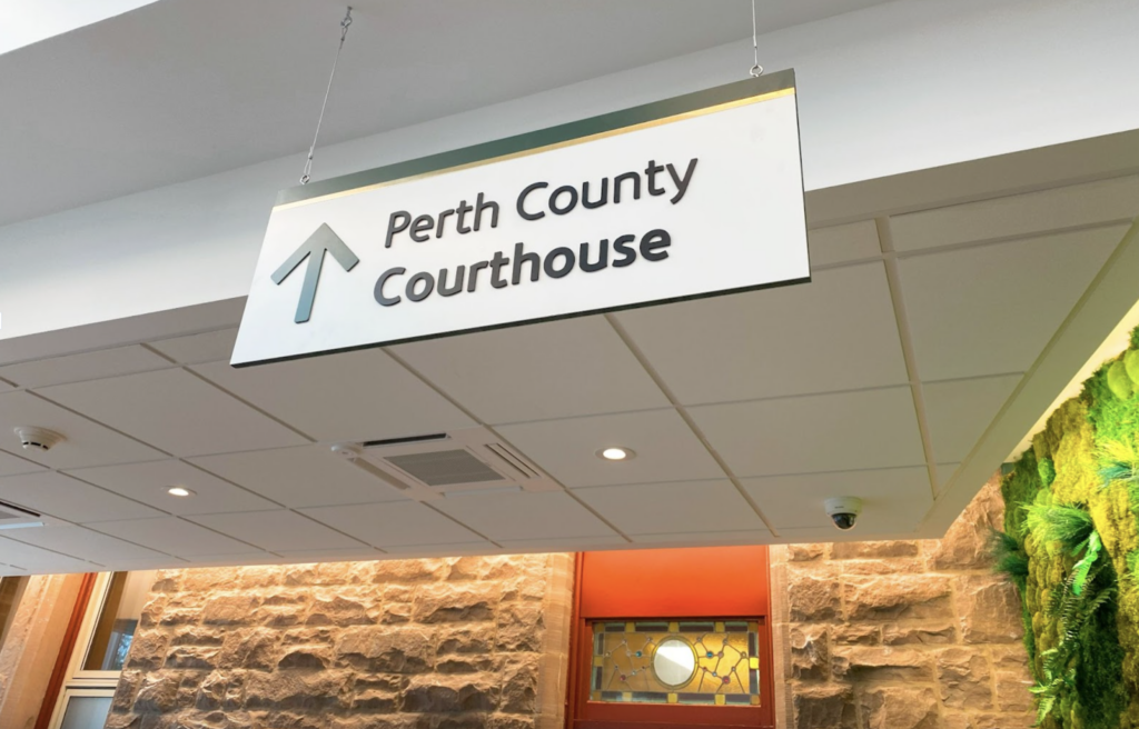 office wayfinding sign that says perth county courthouse
